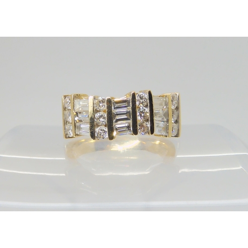 2718 - A 14K GOLD DIAMOND DRESS RINGset with estimated approx 1.38cts of brilliant and baguette cut diamond... 