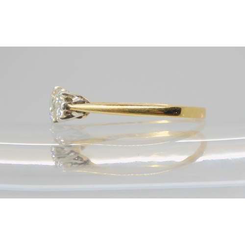 2723 - A THREE STONE DIAMOND RINGmounted throughout in 18ct gold, and set with estimated approx 0.91cts in ... 