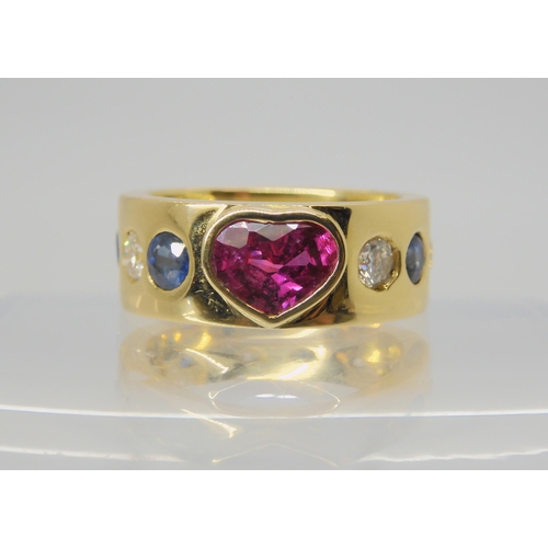 2733 - A GEM SET STATEMENT RINGset with a pink heart shaped gem to the front with sapphires and diamonds se... 