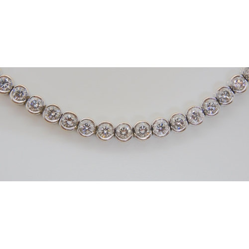 2737 - AN 18CT WHITE GOLD DIAMOND TENNIS BRACELETset with estimated approx 4.5cts of brilliant cut diamonds... 