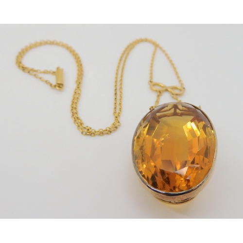2740 - A LARGE CITRINE PENDANT with infinity symbol and chain links. Dimensions of the citrine 2.9cm x 1.9c... 