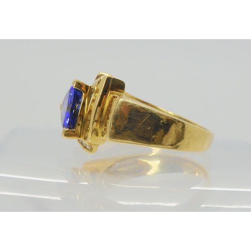 2741 - A LE VIAN TANZANITE AND DIAMOND RINGthe 18ct yellow gold dress ring set with a trilliant cut tanzani... 
