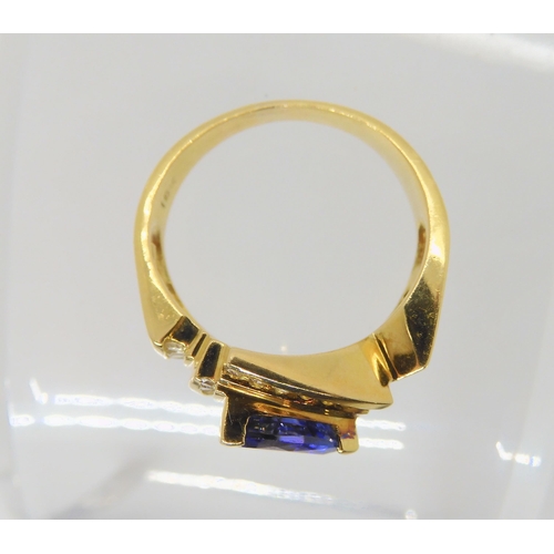 2741 - A LE VIAN TANZANITE AND DIAMOND RINGthe 18ct yellow gold dress ring set with a trilliant cut tanzani... 