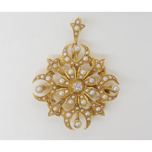 2744 - AN EDWARDIAN PENDANT BROOCHthe 15ct gold pendant is set with split pearls and a central old cut diam... 