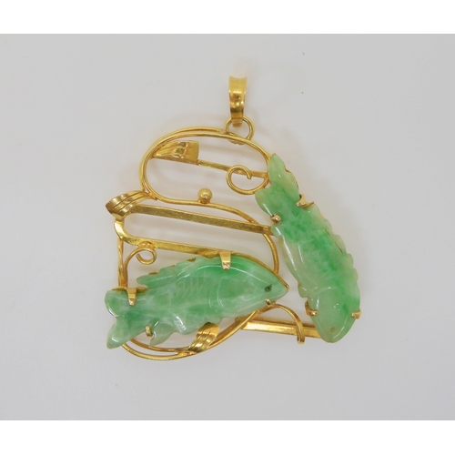 2746 - CHINESE GREEN HARDSTONE FISH PENDANTthe mount is stamped 14k and set with two carved fish. length wi... 