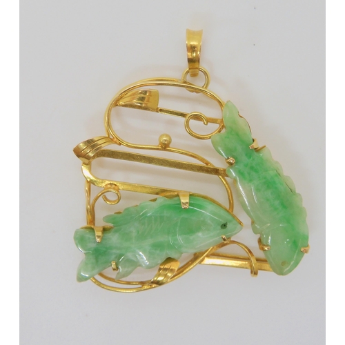 2746 - CHINESE GREEN HARDSTONE FISH PENDANTthe mount is stamped 14k and set with two carved fish. length wi... 