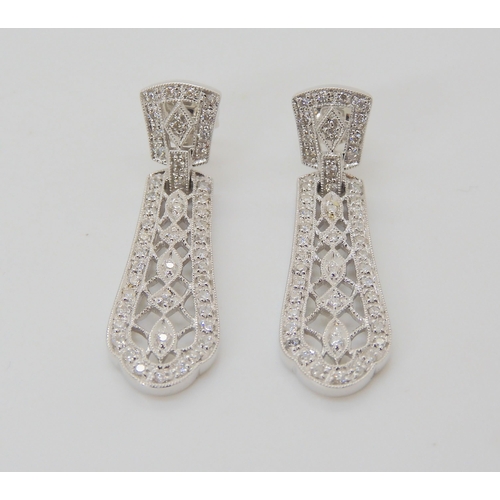 2753 - A PAIR OF DIAMOND DROP EARRINGSset with brilliant cut diamonds to the pierced and milgrain panels. L... 