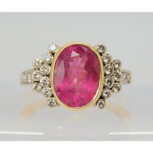 2756 - A PINK TOURMALINE AND DIAMOND RINGthe mount is stamped 750 for 18ct, and set with a 10.8mm x 8.3mm x... 