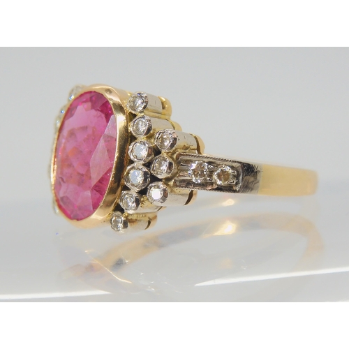 2756 - A PINK TOURMALINE AND DIAMOND RINGthe mount is stamped 750 for 18ct, and set with a 10.8mm x 8.3mm x... 