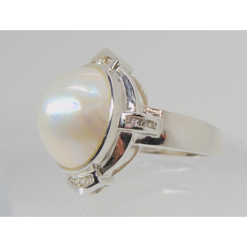 2759 - A MABE PEARL & DIAMOND RINGset in 14k white gold, the mabe pearl measures 14mm in diameter and i... 