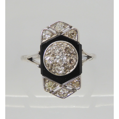 2760 - AN OLD CUT DIAMOND AND ONYX RINGthe white metal mount is set with estimated approx 0.40cts of old cu... 