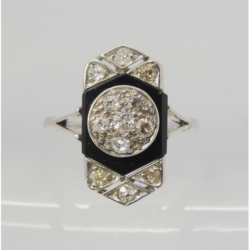 2760 - AN OLD CUT DIAMOND AND ONYX RINGthe white metal mount is set with estimated approx 0.40cts of old cu... 