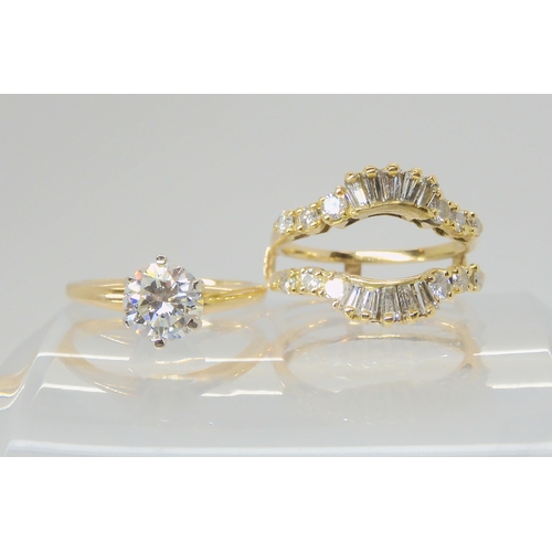 2766 - A 14K TWO PART DIAMOND DRESS RINGcomprising of a removable diamond solitaire of estimated approx 1ct... 