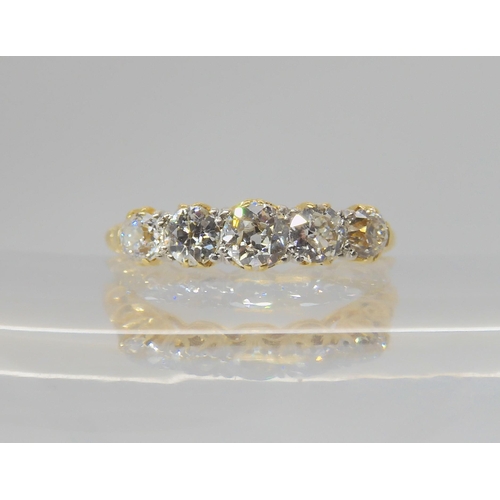 2768 - A FIVE STONE DIAMOND RINGset with estimated approx 0.75cts of old cut diamonds, to a classic scroll ... 