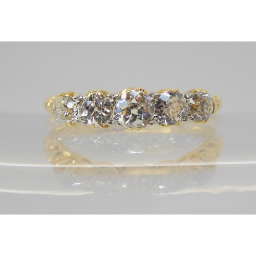 2768 - A FIVE STONE DIAMOND RINGset with estimated approx 0.75cts of old cut diamonds, to a classic scroll ... 