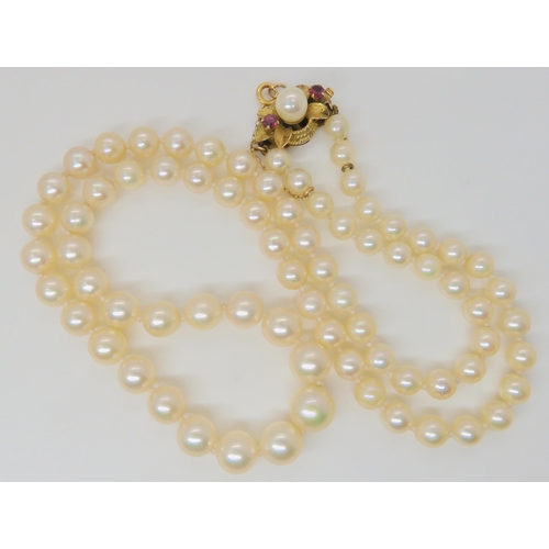 2769 - PEARLS WITH A 14K RUBY AND PEARL CLASPthe light cream coloured pearls with a good lustre, are tapere... 