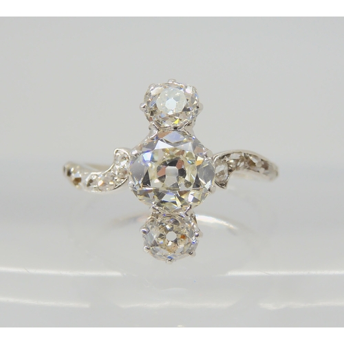 2770 - A VINTAGE THREE STONE DIAMOND RINGthe central old cut is estimated approximately at 0.95cts, with th... 