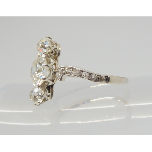 2770 - A VINTAGE THREE STONE DIAMOND RINGthe central old cut is estimated approximately at 0.95cts, with th... 