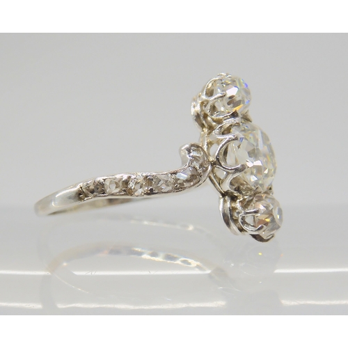 2770 - A VINTAGE THREE STONE DIAMOND RINGthe central old cut is estimated approximately at 0.95cts, with th... 