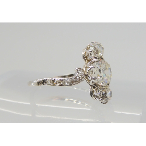 2770 - A VINTAGE THREE STONE DIAMOND RINGthe central old cut is estimated approximately at 0.95cts, with th... 