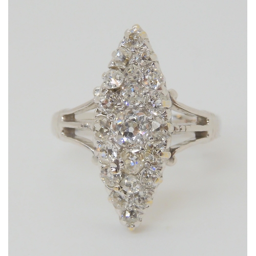 2773 - A MARQUIS DIAMOND CLUSTER RINGset throughout in 18ct white gold, hallmarked Birmingham 1938. Mounted... 