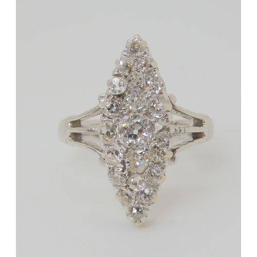 2773 - A MARQUIS DIAMOND CLUSTER RINGset throughout in 18ct white gold, hallmarked Birmingham 1938. Mounted... 