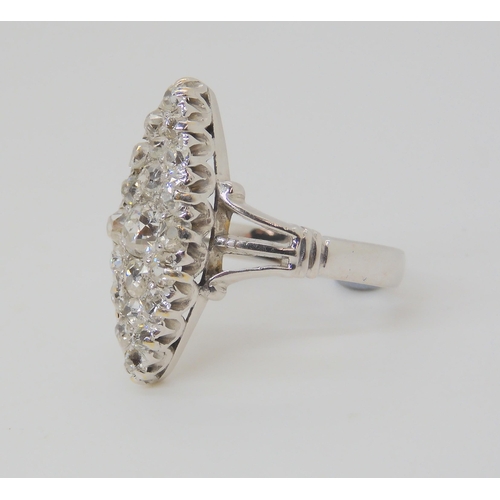 2773 - A MARQUIS DIAMOND CLUSTER RINGset throughout in 18ct white gold, hallmarked Birmingham 1938. Mounted... 