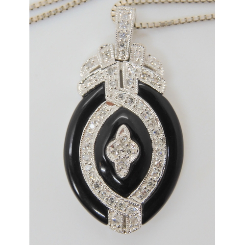 2774 - AN ONYX & DIAMOND PENDANT AND EARRINGSthe pendant stamped 14k, is set with estimated approx 0.50... 