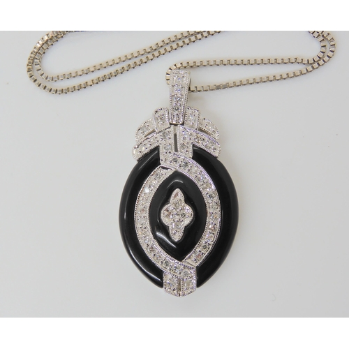 2774 - AN ONYX & DIAMOND PENDANT AND EARRINGSthe pendant stamped 14k, is set with estimated approx 0.50... 