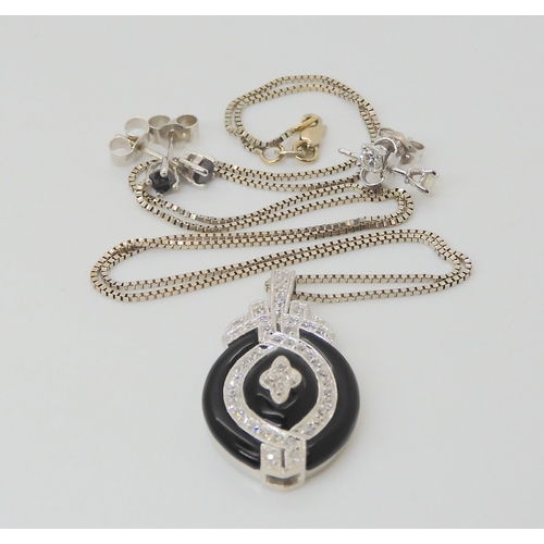 2774 - AN ONYX & DIAMOND PENDANT AND EARRINGSthe pendant stamped 14k, is set with estimated approx 0.50... 