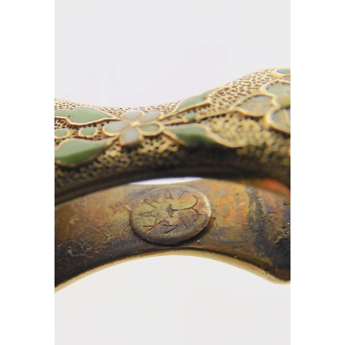 2777 - A PAIR OF ENAMELLED LORGNETTESmade in yellow metal stamped '14karat with a cats nose & mouth des... 