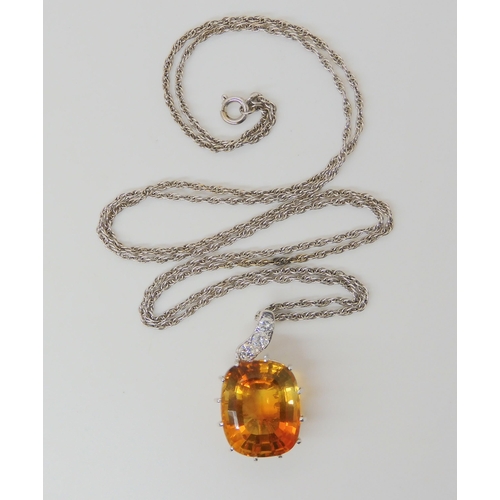 2780 - A CITRINE & DIAMOND PENDANTthe large mixed cut citrine has dimensions of 15mm x 18mm, the pendan... 