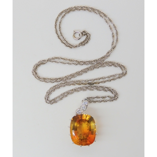 2780 - A CITRINE & DIAMOND PENDANTthe large mixed cut citrine has dimensions of 15mm x 18mm, the pendan... 