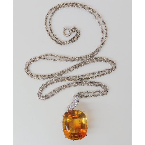 2780 - A CITRINE & DIAMOND PENDANTthe large mixed cut citrine has dimensions of 15mm x 18mm, the pendan... 