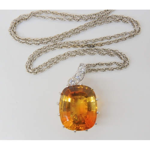 2780 - A CITRINE & DIAMOND PENDANTthe large mixed cut citrine has dimensions of 15mm x 18mm, the pendan... 