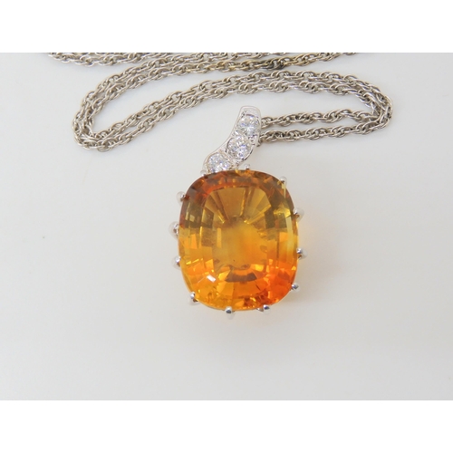 2780 - A CITRINE & DIAMOND PENDANTthe large mixed cut citrine has dimensions of 15mm x 18mm, the pendan... 