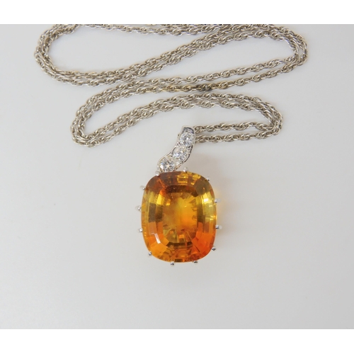 2780 - A CITRINE & DIAMOND PENDANTthe large mixed cut citrine has dimensions of 15mm x 18mm, the pendan... 