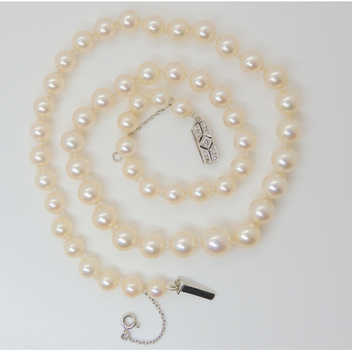 2782 - A STRING OF GOOD QUALITY PEARLSwith a white metal diamond set clasp. Largest pearl 9.4mm tapering to... 