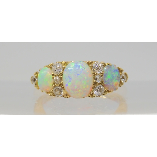 2783 - A VINTAGE OPAL & DIAMOND RINGwith an 18ct gold galleried mount. Largest opal approx 7mm x 5.5mm,... 