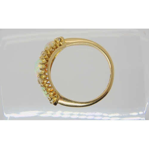 2783 - A VINTAGE OPAL & DIAMOND RINGwith an 18ct gold galleried mount. Largest opal approx 7mm x 5.5mm,... 