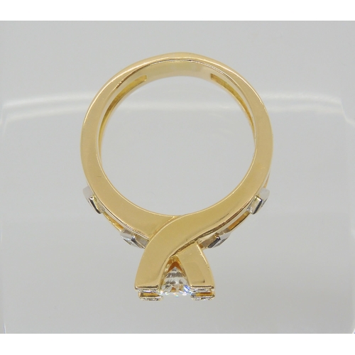 2784 - A RETRO 18CT GOLD SOLITAIRE DIAMOND RINGset with an estimated approx 0.60ct brilliant cut diamond, f... 