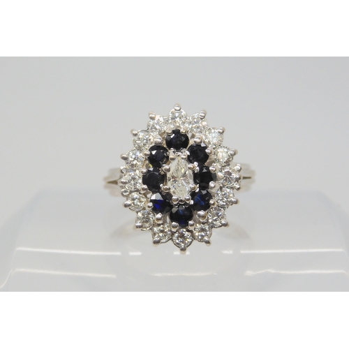 2785 - A SAPPHIRE & DIAMOND CLUSTER RINGhandmade throughout in 18ct white gold, with basket setting sup... 