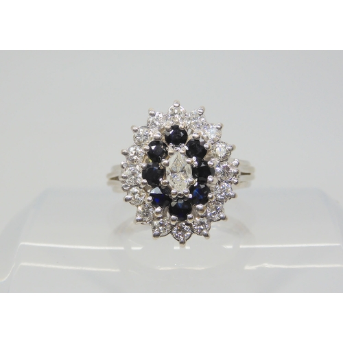 2785 - A SAPPHIRE & DIAMOND CLUSTER RINGhandmade throughout in 18ct white gold, with basket setting sup... 