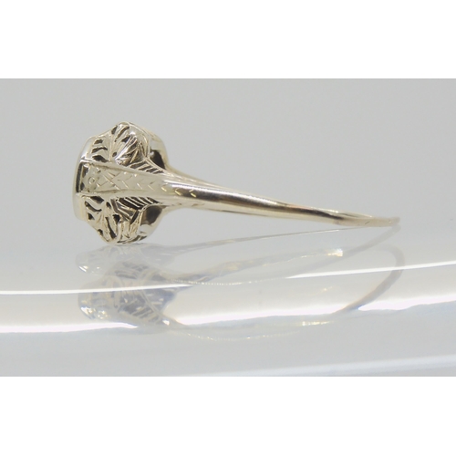 2786 - AN AMERICAN DIAMOND SOLITAIRE RINGwith foliate pierced mount, and engraved shank. Set with an estima... 