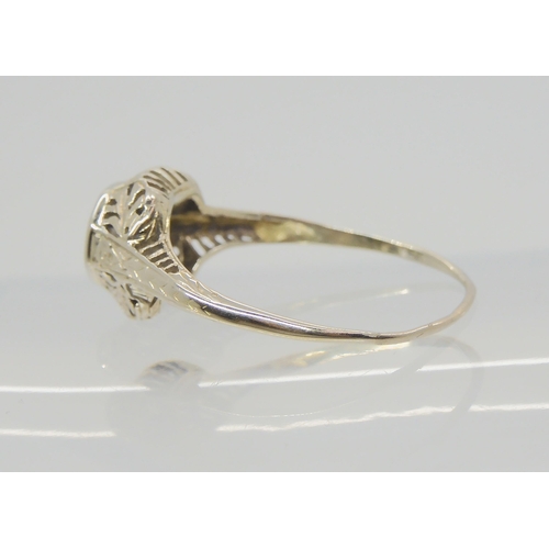 2786 - AN AMERICAN DIAMOND SOLITAIRE RINGwith foliate pierced mount, and engraved shank. Set with an estima... 