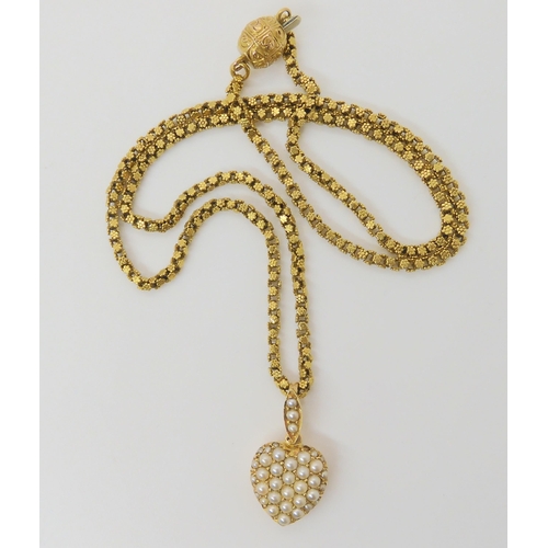 2791 - A VINTAGE PEARL HEART PENDANTthe bright yellow metal heart is set with split pearls, length with bai... 