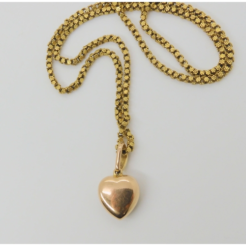 2791 - A VINTAGE PEARL HEART PENDANTthe bright yellow metal heart is set with split pearls, length with bai... 