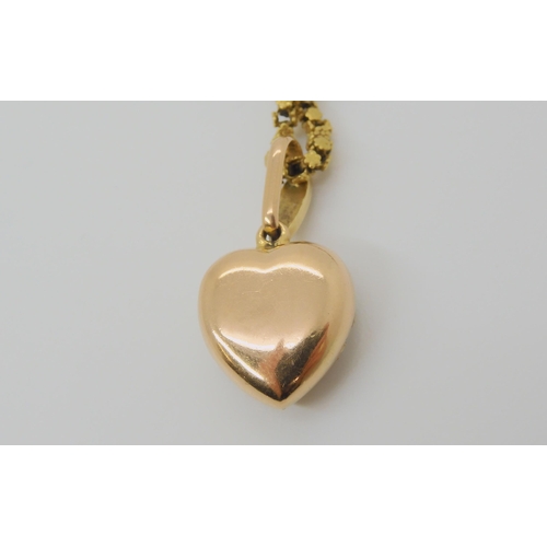 2791 - A VINTAGE PEARL HEART PENDANTthe bright yellow metal heart is set with split pearls, length with bai... 