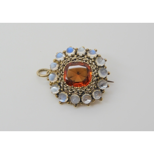 2793 - A HESSONITE GARNET & MOONSTONE PENDANTthe orange garnet is st in a white metal chain link settin... 