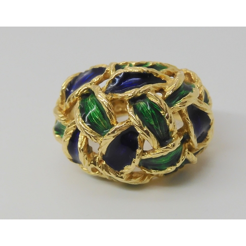 2799 - AN ENAMELLED KUTCHINSKY RINGthe woven pattern enamelled in blue and green, Full Kutchinsky signature... 